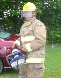 Firefighter Chuck Smith holding the new "Jaws of Life"